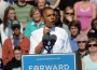 Picture of President Obama with a "Forward" sign in at a podium pointing